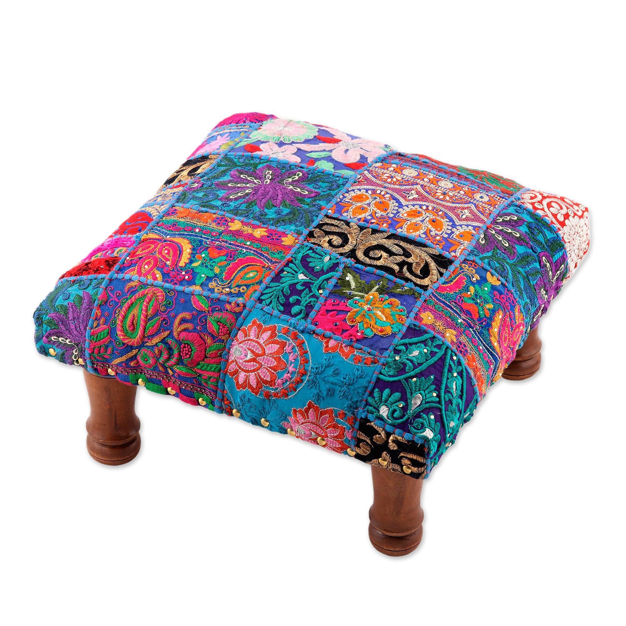 Low multicolor embroidered patchwork ottoman with turned wood legs