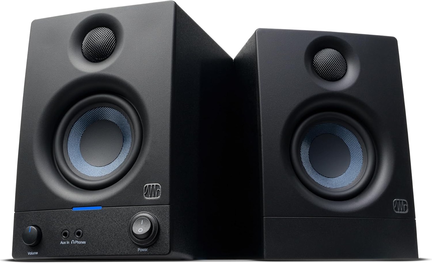 Pair of compact black powered studio monitor speakers